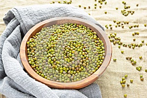 Mung beans or mash peas in wooden bowl