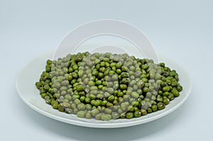 Mung beans in plate isolated on white background
