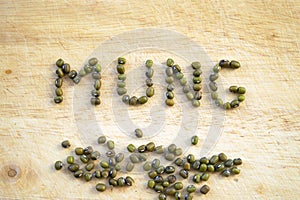 Mung beans on wooden background