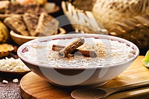 MungunzÃÂ¡ bowl, or Canjica, traditional sweet of the Brazilian June festivals, with typical Brazilian sweets and pocket in the photo