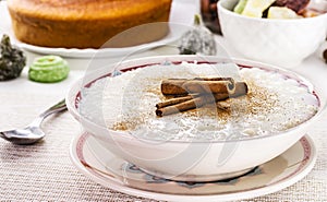MungunzÃÂ¡, or Canjica, a traditional sweet from the Brazilian June festivals, with typical Brazilian sweets and a pocket in the photo