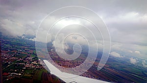 Munich, Bavaria, Germany- September 03, 2018: View On Clouds and earth From The Lufthansa Air Company Airplane Window During The photo