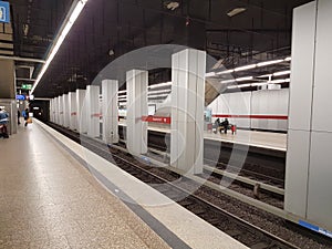 MUNICH, GERMANY - APRIL 2, 2020: A photo of a old subway train arriving to a deserted  Main Trainstation station in Munich