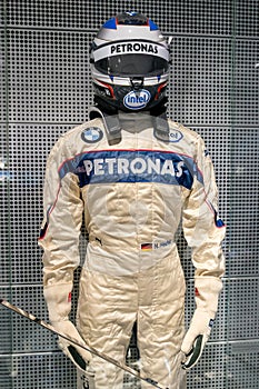 Munich, Germany - March 10, 2016: Formula One suit of BMW race car driver wearing protective leather and helmet