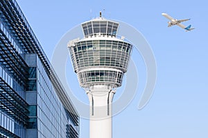 Munich international airport control tower and departing taking off photo