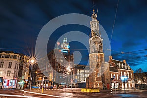 Munt Tower or Munttoren in Amsterdam historical center, night city, Netherlands