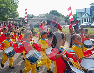 Marching Band Of Elementary School Students With Colorful Costumes