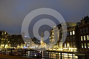 Munttoren as seen from the river Amstel at night