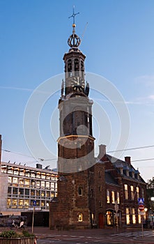 The Munttoren- Mint Tower Muntplein square, where the Amstel river and the Singel canal meet, Amsterdam, Netherlands.