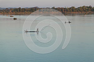 Muong Khong Laos 1.12.2012 Mekong river at sunset with and fishing boat and nets