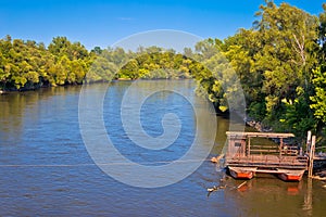 Mura river ferry boat and green landscape