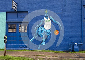 Mural in Deep Ellum featuring Dallas Mavericks basketball star Kristaps Porzingis, nicknamed the Unicorn. photo