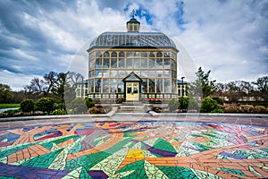 Mural on the ground and the Howard Peters Rawlings Conservatory