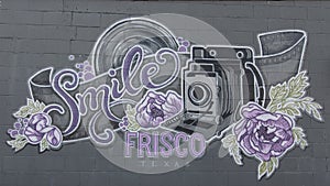 Mural highlighting photography on Main Street in downtown Frisco, Texas.