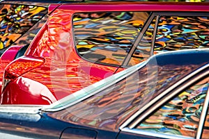 Mural reflected in car windows and paintwork photo