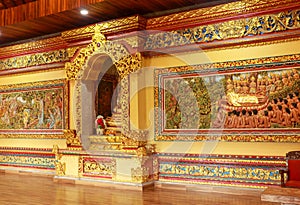 Murals and carvings of Brahma vihara arama. Carved Picture on the temple wall, Bali, Indonesia