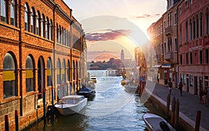 Murano island, Venice, Veneto, Italy. Channel with boats sunset