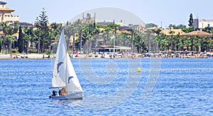 Murcia, Spain, August, 28, 2019: Family having fun in a yacht sailing through the mediterranean sea during season of Summer.