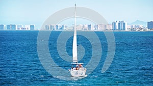 Murcia, Spain, June, 22, 2020: Family having fun in a yacht sailing through the mediterranean sea during season of Summer.