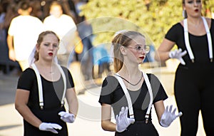 Murcia, Spain, September 12, 2019: Three girls-mimes entertain a performance on a parade at the street