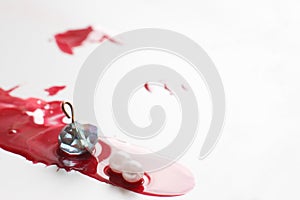 Murder, blood drop on white background. Modern art