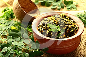 Muriga ila, ela thoran from Kerala cuisine. cooked in earthen ware