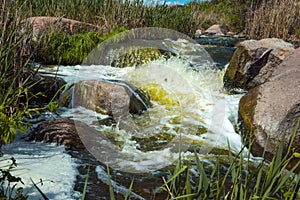 The murmuring waters of the Tokovsky waterfall in Ukraine. photo