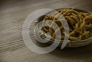 Murukku is a savory, crunchy snack originating from the Indian subcontinent.Its an Indian traditional tea time snack chakli, a