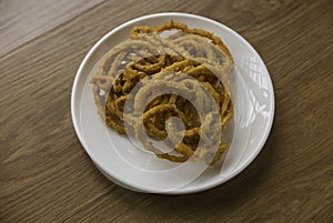 Murukku is a savory, crunchy snack originating from the Indian subcontinent.Its an Indian traditional tea time snack chakli, a