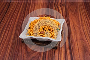 murukku or traditional indian snack chakli and chakali on background.