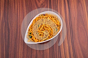 murukku or traditional indian snack chakli and chakali on background.