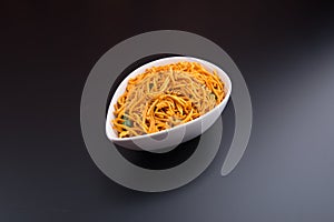 murukku or traditional indian snack chakli and chakali on background.