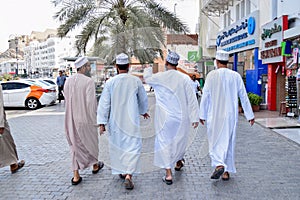 Group of men wearing dishdasha, in Muscat.