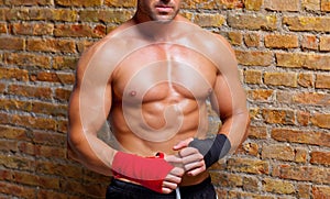 Muscle boxer shaped man with fist bandage