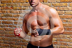 Muscle boxer shaped man with fist bandage