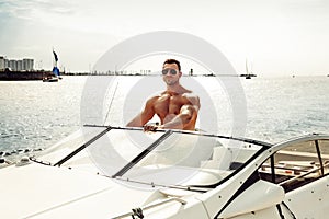 Muscle man on a boat