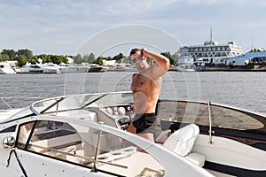 Muscle man on a boat