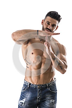 Muscle man gesturing time out sign with his hands