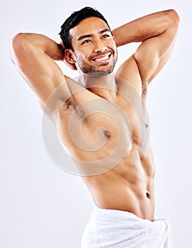 Muscle, man and shower with towel for hygiene on studio background thinking of skincare in mockup. Beauty, model and