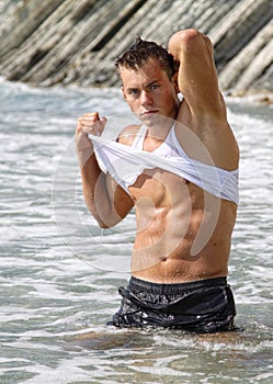 Muscle wet man in sea water