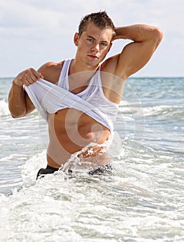 Muscle wet man in sea water