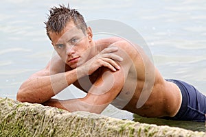 Muscle wet naked man in sea water