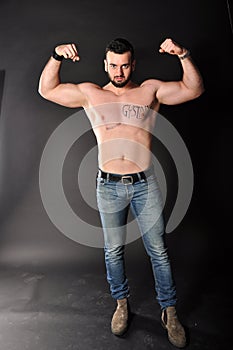 Muscle young man posing in studio