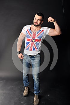 Muscle young man posing in studio