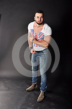 Muscle young man posing in studio