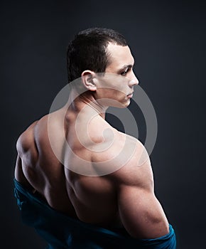 Muscled male model showing his back