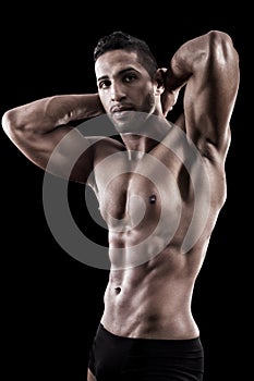 Muscled man on a black background