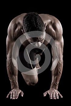 Muscled man on a black background