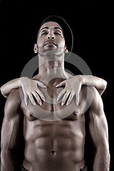 Muscled man on a black background