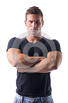 Muscled Man Crossing Arms with Serious Face